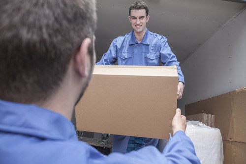 Removal team sorting recyclable items for a sustainable clearance in Marylebone