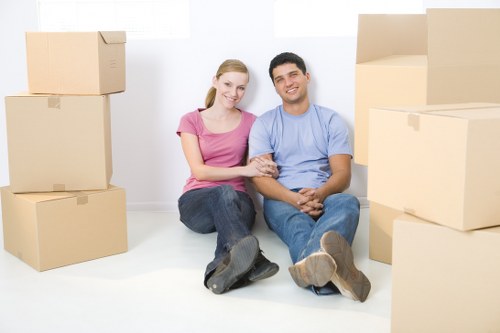 Packed moving boxes and furniture ready for transport