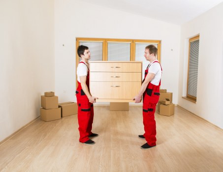 Removal crew loading boxes and furniture for a central London move
